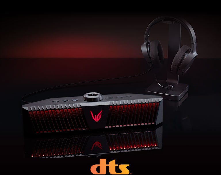 A gaming speaker is placed on black desk and there is a headset placed right behind - a DTS logo is placed on bottom center of image.