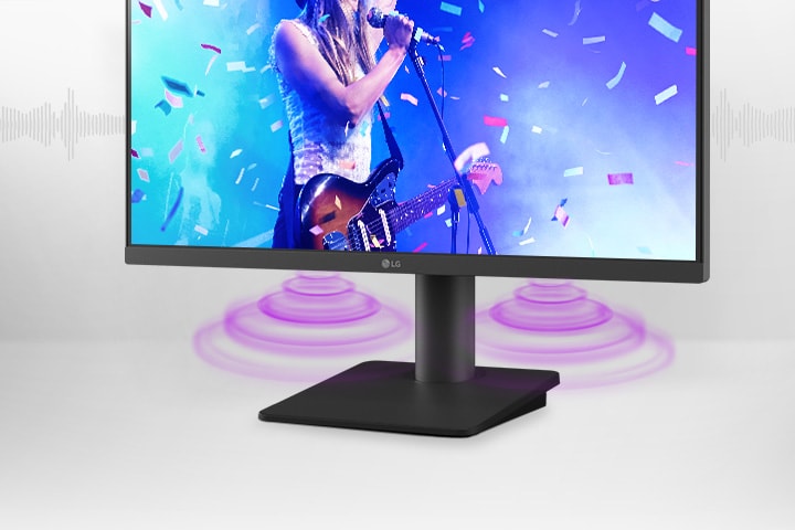 The monitor screen shows a singer performing a song, with sound coming from the speakers at the bottom of the monitor.