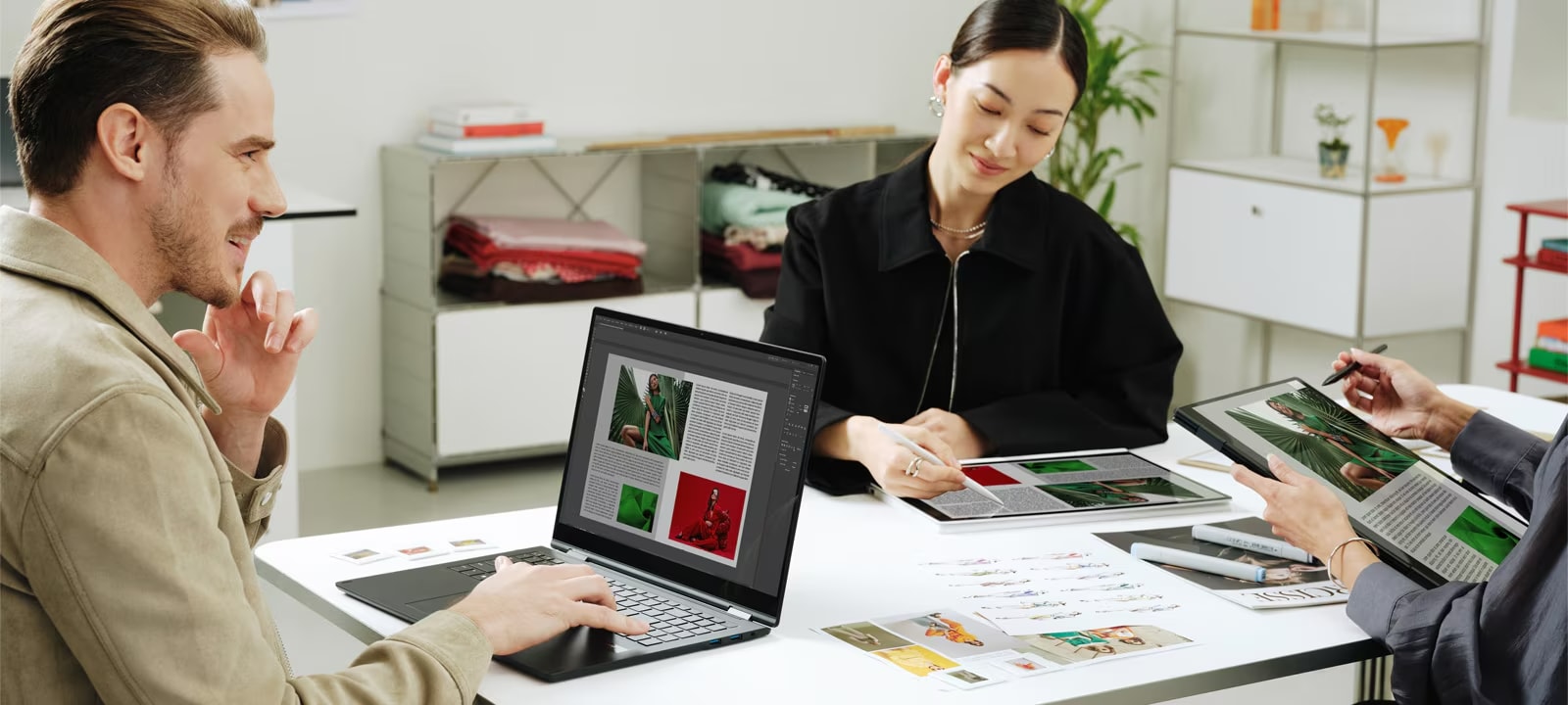 Three professionals in a meeting, each working on their LG gram laptops.