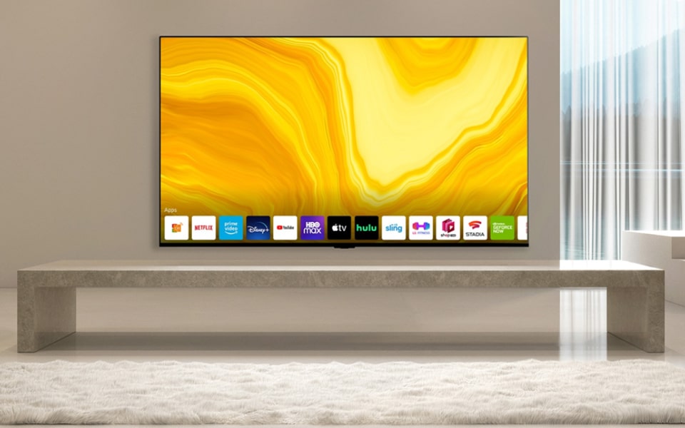 A minimalist modern living room featuring a sleek LG TV on a stone console, with bright yellow art displayed on the screen. The clean, elegant design emphasises both style and functionality.