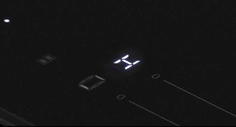 The &quot;H&quot; LED light which is a residual heat indicator on the induction hob.