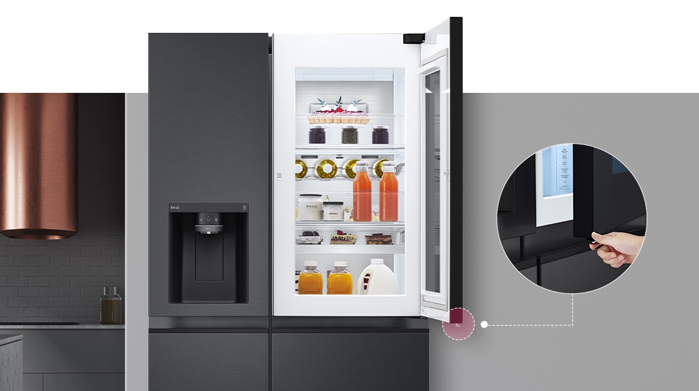 The front view of a black InstaView refrigerator. The door-in-door of the refrigerator is open. There's a small screen that explains where a concealed opening button is to open the door.