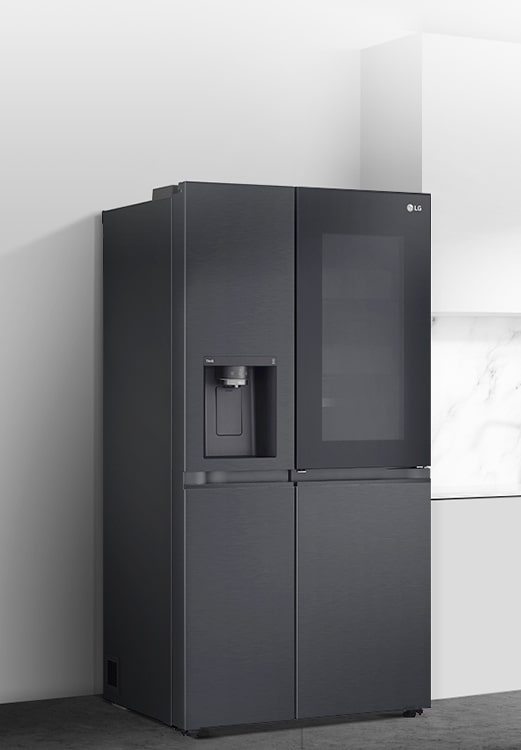 A side view of a kitchen with a black InstaView refrigerator installed.