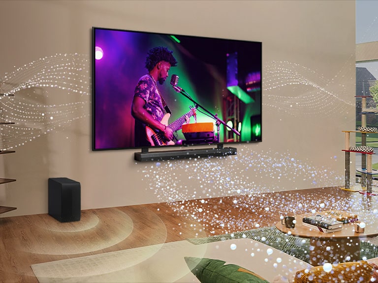 An image of an LG TV and LG Soundbar in a living room playing a musical performance. White droplets make waves of sound that shoot upwards and forward from the soundbar and project from the TV, depicting the unique tonal palettes of the TV speakers and soundbar coming together.