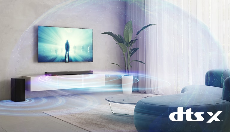 In the living room, LG TV is on the wall. A moive is playing on TV screen. LG Sound bar is right below TV on a beige shelf with a rear speaker is placed on left. Dolby Atmos and DTS:X logo shown on middle bottom of image.