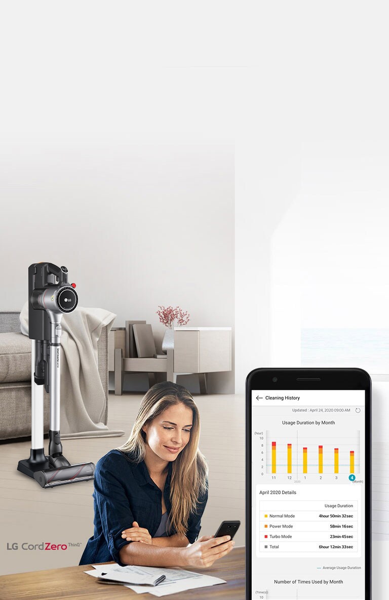 The vacuum in the charging stand is in a living room in the background with a woman looking at her phone in the foreground. An image of the phone screen shows the cleaning history of her product.