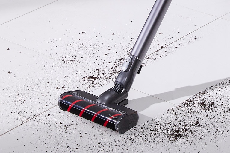 Three images in line: the first shows the vacuum vacuuming dirt from a hard surface, second shows vacuuming chips from a carpet, and the third shows the Power Punch on bedding.