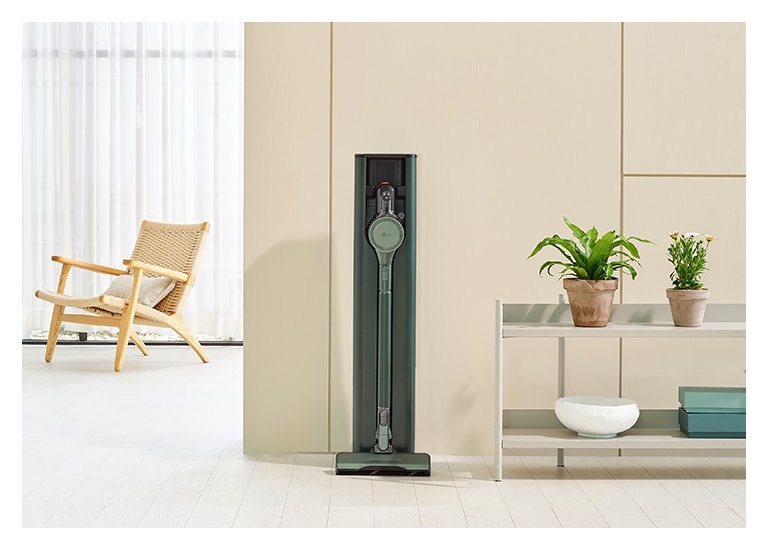 Image of calming green colour LG CordZero All-in-One Tower placed in a modern living room.