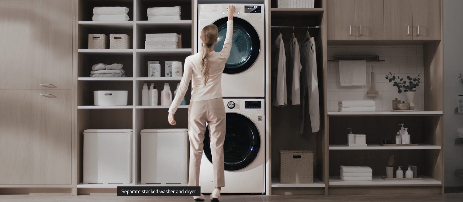 The first image is a combination of two images, one a older style white washer and dryer stacked on top of each other and installed in a wall unit and one a black LG Wash Tower installed in a wall unit. A dotted line and a red circle icon at the center with arrows indicates you can move from left to right to see each image in its entirety.