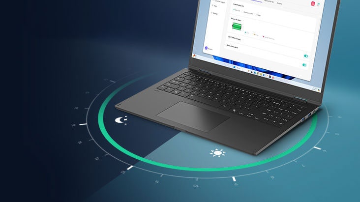 A laptop displaying a battery usage interface on its screen, surrounded by a circular visual representation of time. The text '22.0 hrs' is prominently featured, highlighting extended battery life.