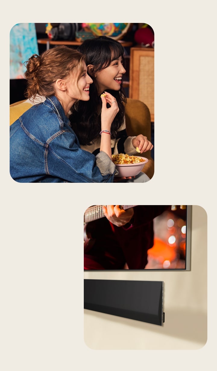 Two women sitting on a sofa eating popcorn. A close-up side angle of the bottom right corner of a wall-mounted LG TV and an LG Soundbar mounted on the wall underneath.