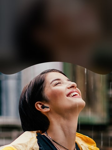 A woman is listening music with LG TONE Free