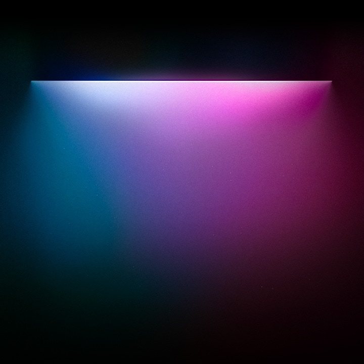 Luzes coloridas azul-esverdeadas, roxas e violeta destacando o texto “Para designs que se encaixam em todos os aspectos de sua vida” abaixo.