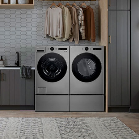 The LG Front Load Washer and Dryer set (WM5500HVA) in Graphite Steel, showcasing its premium aesthetic and seamless integration into a stylish, modern laundry room.
