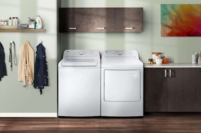 The LG Top Load Washer and Dryer set (WT6105CW) in White, showcasing its classic aesthetic and seamless side-by-side integration into a modern laundry room.