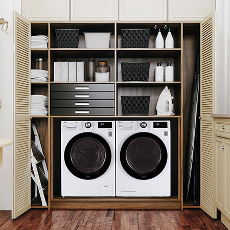 The Compact LG Front Load Washer and Dryer set (WM1455HWA) in White, showcasing the flexible side-by-side installation option within a built-in closet space.