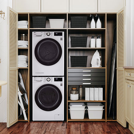 The Compact LG Front Load Washer and Dryer set (WM1455HWA) in White, showcasing the space-saving vertical stacking option within a built-in closet.