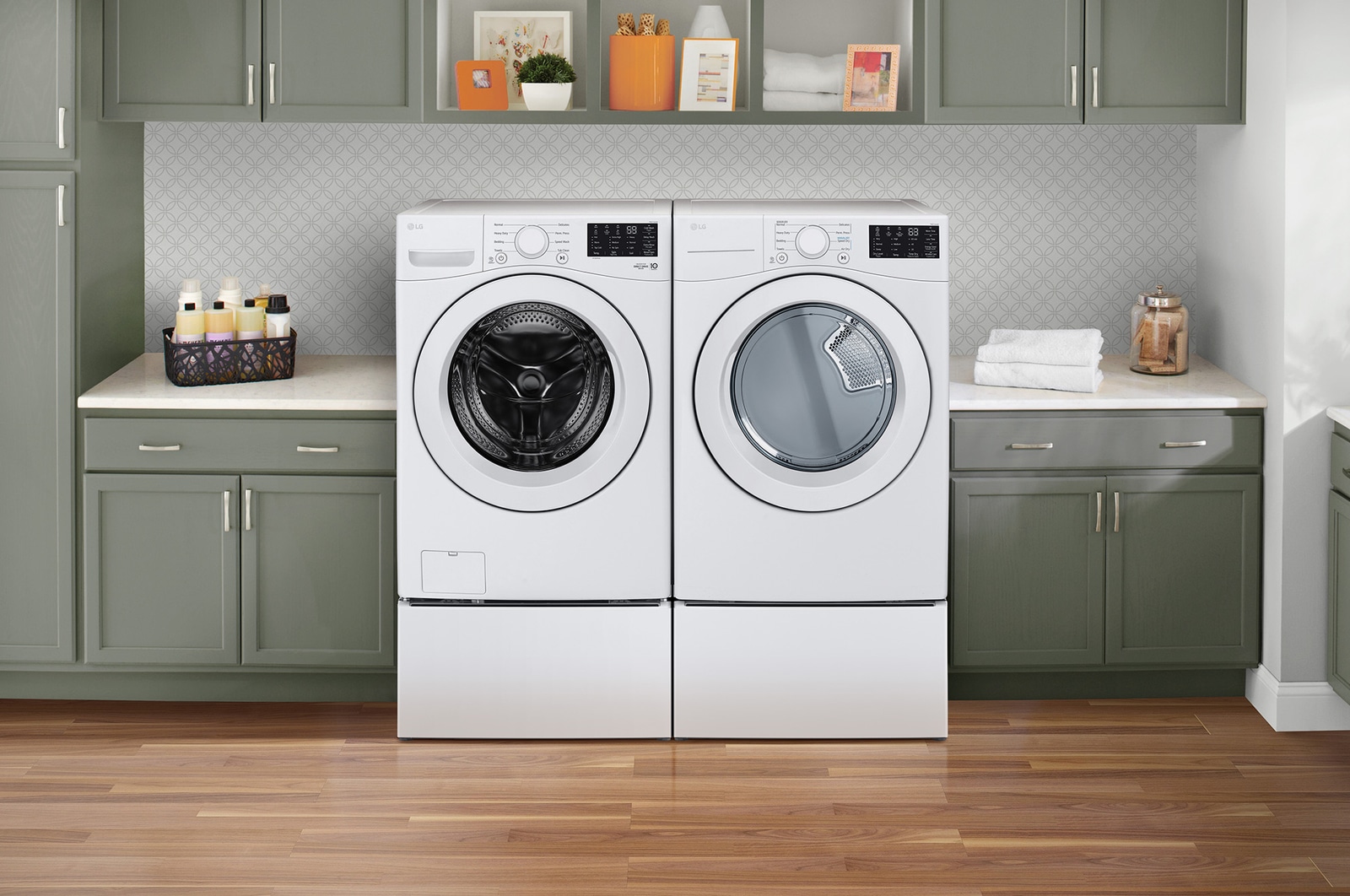 The LG Front Load Washer and Dryer set (WM3470CW) in White, showcasing its classic aesthetic and seamless side-by-side integration on pedestals in a modern laundry room.