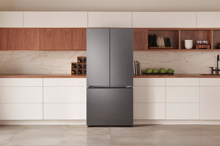 The PrintProof™ Black Stainless Steel LG 33-inch 25 cu.ft. French Door Refrigerator LF25S6200D, shown installed in a modern kitchen.