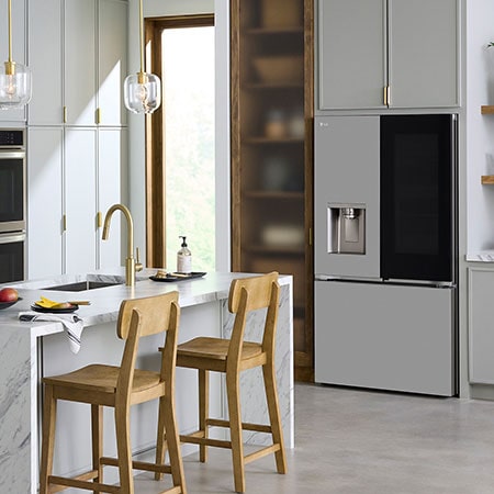 The PrintProof™ Stainless Steel LG 36-inch 26 cu.ft. French Door Refrigerator LF26C6360S with InstaView® Door-in-Door®, shown in a bright modern kitchen.
