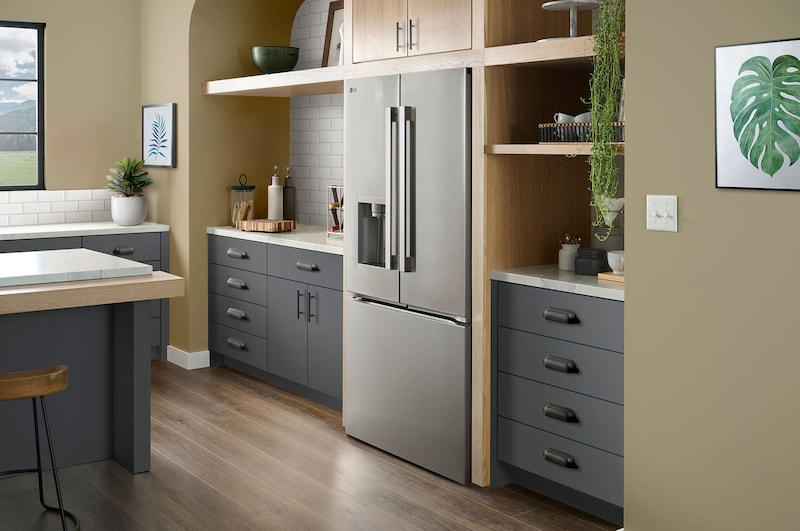 The PrintProof™ Stainless Steel LG 36-inch 24 cu.ft. French Door Refrigerator LF24Z6530S with ice & water dispenser, shown in a modern kitchen.