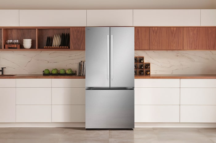 The PrintProof™ Stainless Steel LG 33-inch 25 cu.ft. French Door Refrigerator LF25H6200S, shown installed in a modern kitchen.