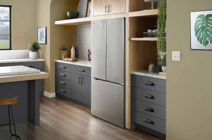 The PrintProof™ Stainless Steel LG 36-inch 25 cu.ft. Counter Depth French Door Refrigerator LF25Z6211S, shown installed in a modern kitchen.