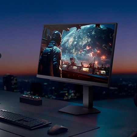 LG UltraGear™ Monitor 27G810A in a modern gaming environment at night, displaying an immersive space combat scene on its screen with a minimalist stand.