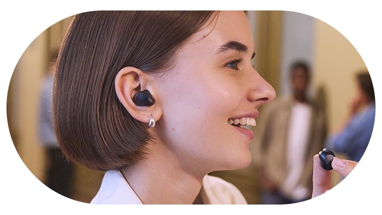 A woman wearing the T80S and using the whisper mode.