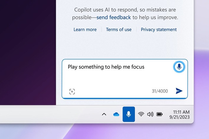 The image shows a digital assistant input box where the user types, "Play something to help me focus." It’s part of a Windows taskbar interface, with standard system icons below, indicating a request for focus music.