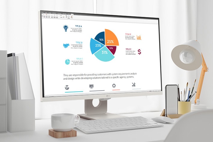 On the table, there is a smart monitor, displaying a home office document being worked on. To the left of the monitor, there is a cup with a handle, and to the right, there is a mobile phone, a pencil holder, and a stand.