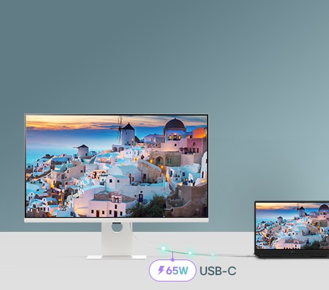 A photo showcasing a smart monitor connected to a laptop via USB-C, demonstrating charging and data transfer.