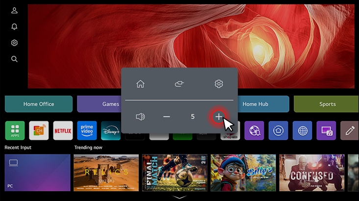 The LG Smart Monitor screen shows the webOS interface, and the volume is being turned up.