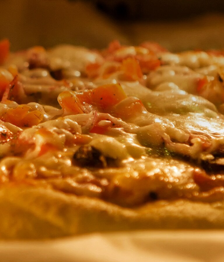 Pizza being heated quickly in the microwave.