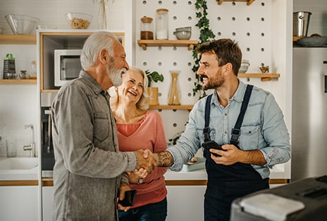 Delivery man handing box to happy customer