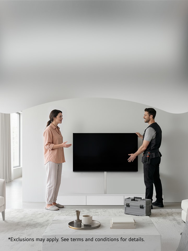 LG technician and customer stand in front of installed on-wall wire concealed TV