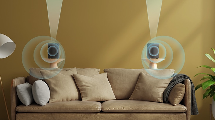 Two rear speakers are placed on a side table behind the sofa with virtual sound effect implying up-firing and going-forward sound.