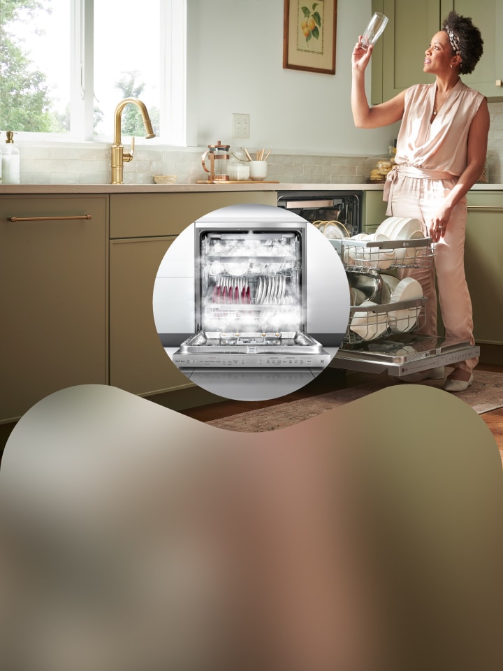LG dishwasher with TrueSteam® technology shown in a modern kitchen, with clean dishes loaded in the open lower rack and a promotional banner highlighting “Dishes That Shine As Bright As You Do.