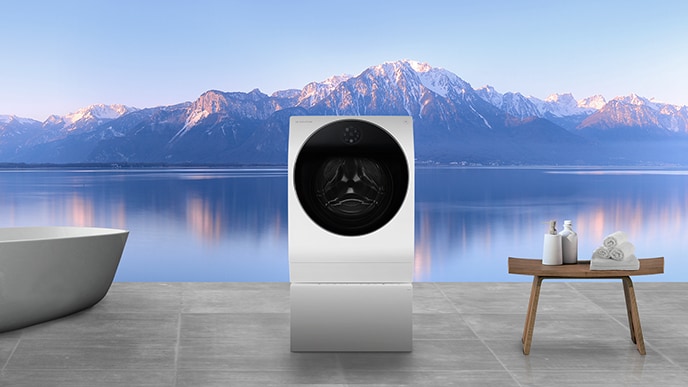 LG SIGNATURE Waschmaschine und Badewanne sind in der Waschküche mit Blick auf die Berge und den Fluss sofort hinter dem Fenster ausgelegt.