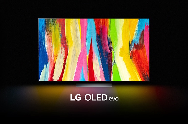 Ein LG OLED C2 befindet sich in einem dunklen Raum mit einem bunten, abstrakten Kunstwerk aus vertikalen Linien auf dem Display und dem Schriftzug "LG OLED evo" darunter.