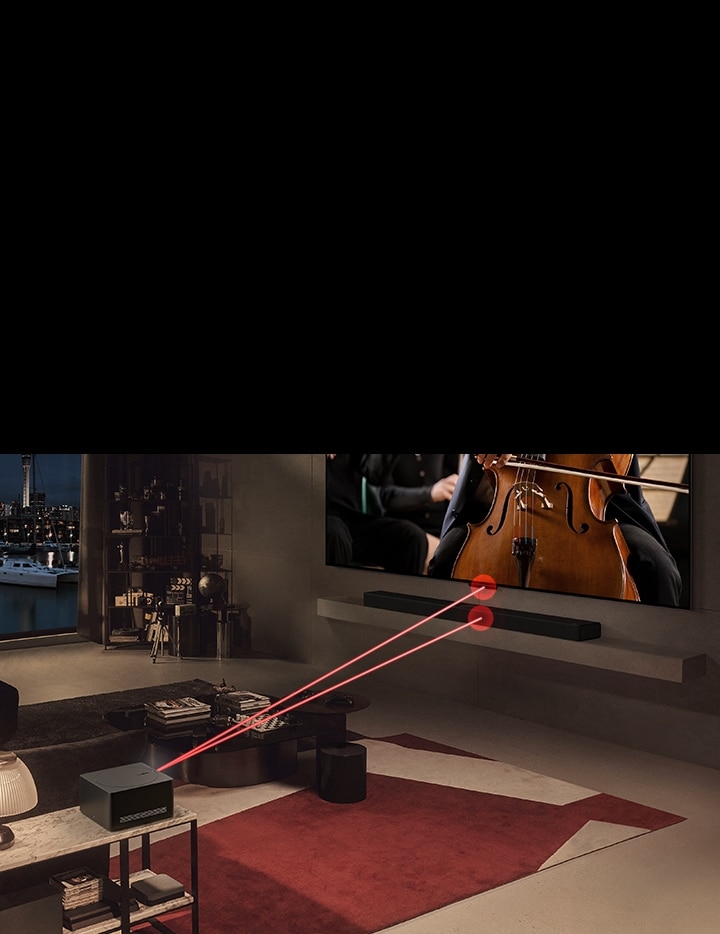 Se reproduce un concierto en la pantalla del LG OLED evo M4, y una Zero Connect Box está al frente. Una señal de Wi-Fi roja aparece sobre la Zero Connect Box y dos haces de luz roja se emiten hacia el televisor y la LG Soundbar.