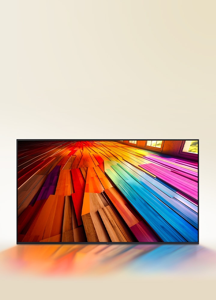 Un largo tramo de piso de madera de colores vibrantes se muestra en un televisor LG UHD.