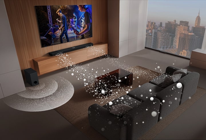 La barra de sonido LG, el televisor LG y el subwoofer se encuentran en una sala de estar mostrando una imagen en pantalla con una actuación musical. Dos ramas de ondas sonoras blancas formadas por gotas se proyectan desde la barra de sonido y un subwoofer crea un efecto de sonido desde abajo.