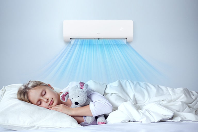 The air conditioner is operating. Below it, a girl is sleeping comfortably holding a doll.