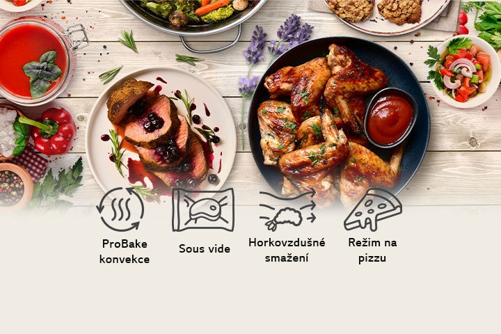 Různé pokrmy na dřevěném stole s funkcemi ProBake, Sous vide, horkovzdušné smažení a režim na pizzu.