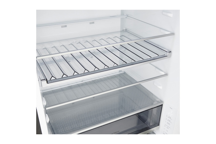 LG fridge freezer (GBBW726AEV) built into dark brown cabinetry with window and sofa on left and sink on right