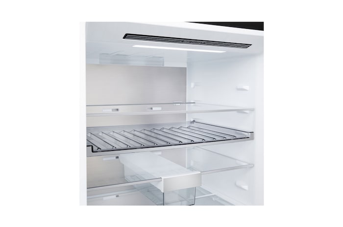 LG bottom freezer (GBBW726AEV) installed flush in tall warm beige wall with white arrows pointing to top side and front surfaces