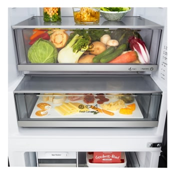 LG fridge freezer (GBBW726AEV) close up of wine rack holding four bottles and box of macarons with rack design magnified in circular image