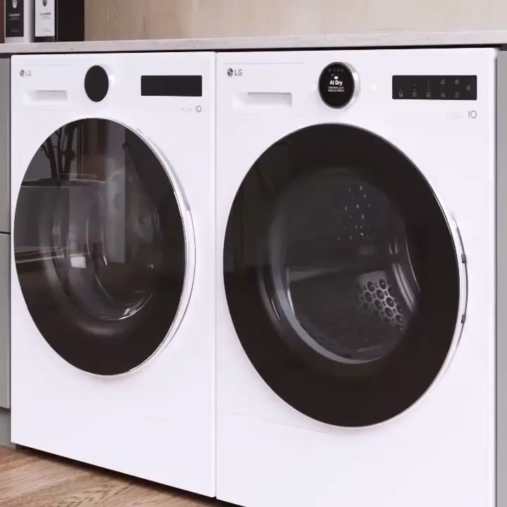 LG black Washing Machine and Dryer stacked vertically inside a cabinet, with items stored on both sides, a sink on the left, and a window with sofa on the right.