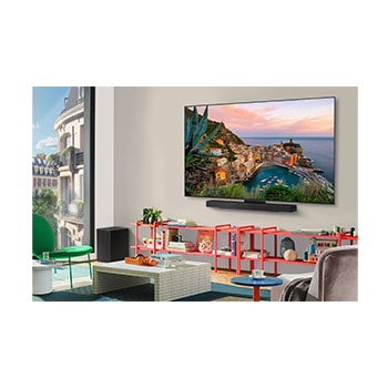 Wide view of a stylish and colorful living room. LG OLED evo AI C5 4K Smart TV is mounted on the wall with an LG Soundbar underneath it. The TV's design blends well with the space. On the TV screen is a colorful artwork. 